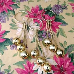 Beautiful set of 3 jingle bells on gold rings.